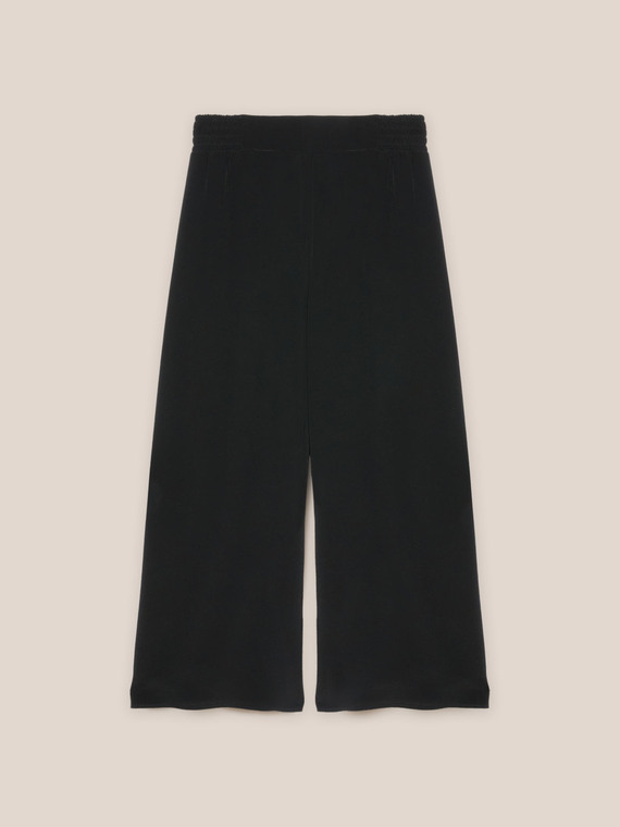 Flowing pinstriped trousers